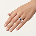 Oval Blue Sapphire Halo Ring with Baguette Diamond Band worn by model - Vicenza Miami
